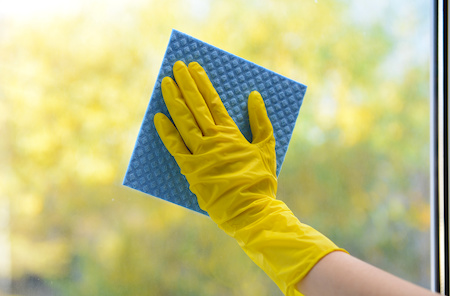 Hands With Napkin Cleaning Window