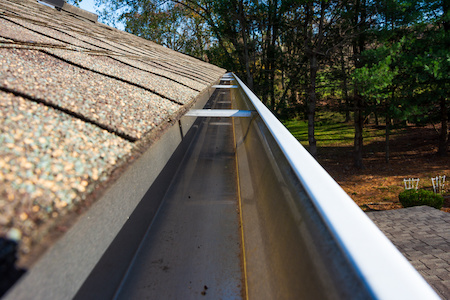 Cleaned Gutters In Front Of The House, K Style, No Need To Climb A Ladder Cleaned Gutters Summer Cleaning Removed Leaves, Twigs, And Debris. Aluminum Gutters No Overflows Now